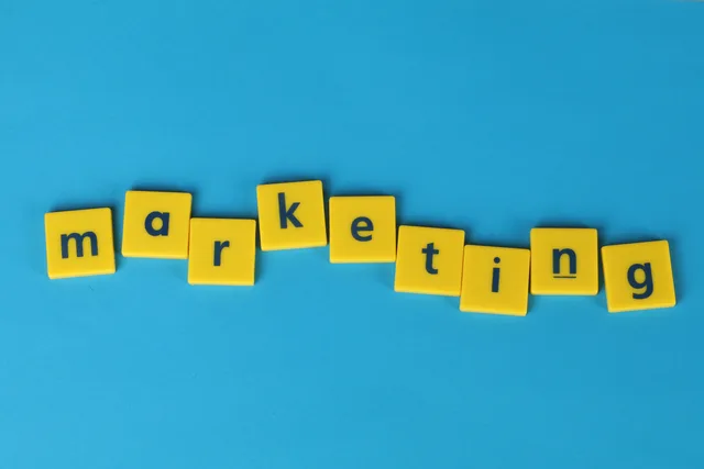 Bright yellow tiles spelling 'marketing' on a blue background, ideal for business themes. Nine steps to build an event marketing ninety day plan