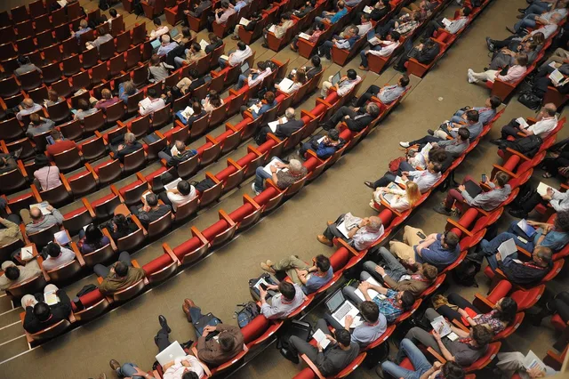 event venue, auditorium, meeting, forum, conference, listener, audience, public, people, sit, watching. VAT on UK event marketing fees and budgets